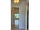 Tiled hallway providing access to the living areas and bedrooms at 2154 Nw 23Rd Loop, Ocala, FL 34475