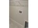 The laundry room features painted walls, tile floors, utility connections, and a wire rack shelf for extra storage at 2154 Nw 23Rd Loop, Ocala, FL 34475