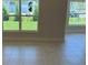 Bright living room with large windows offering a view of the green outdoors and tiled floor at 2154 Nw 23Rd Loop, Ocala, FL 34475