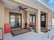 Back patio with double doors and seating at 22287 Sw Mango Ln, Dunnellon, FL 34431