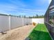 Backyard with artificial turf and fence at 22287 Sw Mango Ln, Dunnellon, FL 34431