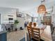 Dining room with wooden table and view into kitchen at 22287 Sw Mango Ln, Dunnellon, FL 34431