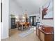 Dining room with wooden table and view to entry at 22287 Sw Mango Ln, Dunnellon, FL 34431