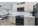 Bright kitchen featuring white cabinets, quartz countertops, and a gas cooktop at 22287 Sw Mango Ln, Dunnellon, FL 34431