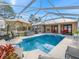 Inviting pool area with lounge chairs at 22287 Sw Mango Ln, Dunnellon, FL 34431