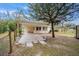 View of the back of the house with attached carport and a shed in the backyard at 2501 Nw 20Th St, Ocala, FL 34475