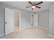 Spacious bedroom with tiled floor leads to modern bathroom with tiled shower at 2501 Nw 20Th St, Ocala, FL 34475