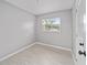 Bright bedroom featuring wood-look tile flooring and a window at 2501 Nw 20Th St, Ocala, FL 34475