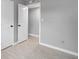 Hallway featuring tile flooring and neutral paint, creating a clean and inviting space at 2501 Nw 20Th St, Ocala, FL 34475