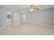 Living room features tile floors, gray walls and access to kitchen at 2501 Nw 20Th St, Ocala, FL 34475