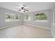 Bright living room with tile floors and large windows overlooking the landscaped backyard at 2501 Nw 20Th St, Ocala, FL 34475