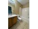 Clean bathroom with a tub, toilet, sink, and tiled flooring at 28 Juniper Loop Ter, Ocala, FL 34480