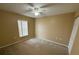 Bright bedroom with carpeted floor, window, and ceiling fan at 28 Juniper Loop Ter, Ocala, FL 34480