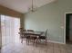 Bright dining area with tile floors and a chandelier at 28 Juniper Loop Ter, Ocala, FL 34480