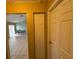 Hallway with view of dining room and storage closet at 28 Juniper Loop Ter, Ocala, FL 34480