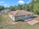 Aerial view of a single-story house with a patio and surrounding land at 3 Locust Trak, Ocala, FL 34472