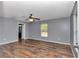 Large bedroom with wood-look floors and ceiling fan at 3 Locust Trak, Ocala, FL 34472