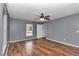 Bedroom featuring wood-look floors and a ceiling fan at 3 Locust Trak, Ocala, FL 34472