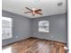 Bedroom with wood-look flooring, ceiling fan and large window at 3 Locust Trak, Ocala, FL 34472