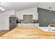 Modern kitchen with white cabinets and wood countertops at 3 Locust Trak, Ocala, FL 34472