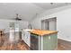 Island kitchen with butcher block countertops and farmhouse sink at 3 Locust Trak, Ocala, FL 34472