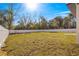 Large backyard with a white privacy fence at 3690 Se 133Rd Pl, Belleview, FL 34420