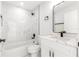 Clean bathroom with marble tile, modern vanity, and bathtub at 3690 Se 133Rd Pl, Belleview, FL 34420