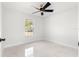 Well-lit bedroom featuring a ceiling fan and marble-look floors at 3690 Se 133Rd Pl, Belleview, FL 34420