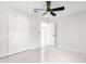 Bedroom with a large closet, marble-look floors and access to another room at 3690 Se 133Rd Pl, Belleview, FL 34420