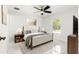 Main bedroom with stylish decor, ceiling fan, and marble flooring at 3690 Se 133Rd Pl, Belleview, FL 34420