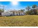 Newly built home with a white exterior and grassy yard at 3690 Se 133Rd Pl, Belleview, FL 34420