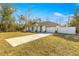 New construction home with a driveway and fenced yard at 3690 Se 133Rd Pl, Belleview, FL 34420