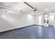 Spacious garage with epoxy flooring and storage at 3690 Se 133Rd Pl, Belleview, FL 34420