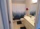 Clean bathroom with shower/tub combo and updated vanity at 4172 Ne 35Th Avenue Rd, Ocala, FL 34479