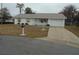 Single-story home with attached garage and carport at 4172 Ne 35Th Avenue Rd, Ocala, FL 34479