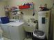 Laundry room with washer, dryer, utility sink, and shelving at 4172 Ne 35Th Avenue Rd, Ocala, FL 34479