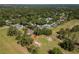 Aerial view of a home nestled on a golf course with mature trees and expansive fairways at 4343 Nw 80Th Ave # 8, Ocala, FL 34482