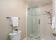 Bathroom featuring glass shower doors, and a toilet at 4343 Nw 80Th Ave # 8, Ocala, FL 34482