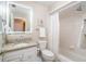 Bright bathroom featuring granite counters and a shower and tub combo at 4343 Nw 80Th Ave # 8, Ocala, FL 34482