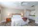 Comfortable bedroom with a ceiling fan and attached bathroom at 4343 Nw 80Th Ave # 8, Ocala, FL 34482