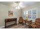 Bright bedroom with plantation shutters, a ceiling fan, and decorative furnishings at 4343 Nw 80Th Ave # 8, Ocala, FL 34482