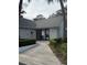 Exterior view of community building with gate at 571 Midway Trak # J103, Ocala, FL 34472