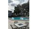 Inviting community pool with lounge chairs at 571 Midway Trak # J103, Ocala, FL 34472