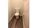 Simple toilet and flooring in a small bathroom at 571 Midway Trak # J103, Ocala, FL 34472