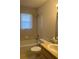 Standard bathroom with a tub and shower combo, toilet, and sink. A functional space with essential amenities at 5980 Se 4Th Pl, Ocala, FL 34472