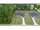 Aerial view of two new homes on a tree-lined street at 6068 Nw 57Th Ave, Ocala, FL 34482