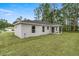 Back of house featuring covered patio and expansive backyard at 6068 Nw 57Th Ave, Ocala, FL 34482