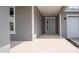 Front entrance with light gray door and gray siding at 6267 Sw 75Th Court Rd, Ocala, FL 34474