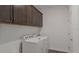 Laundry room with washer, dryer, and ample cabinets at 6267 Sw 75Th Court Rd, Ocala, FL 34474