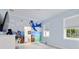 bedroom with whimsical plane mural and en-suite bathroom at 7267 Se 12Th Cir, Ocala, FL 34480